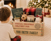 Personalized family Christmas box filled with cocoa book and holiday gifts