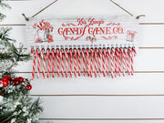 Reusable candy cane Christmas countdown calendar with jute hanger