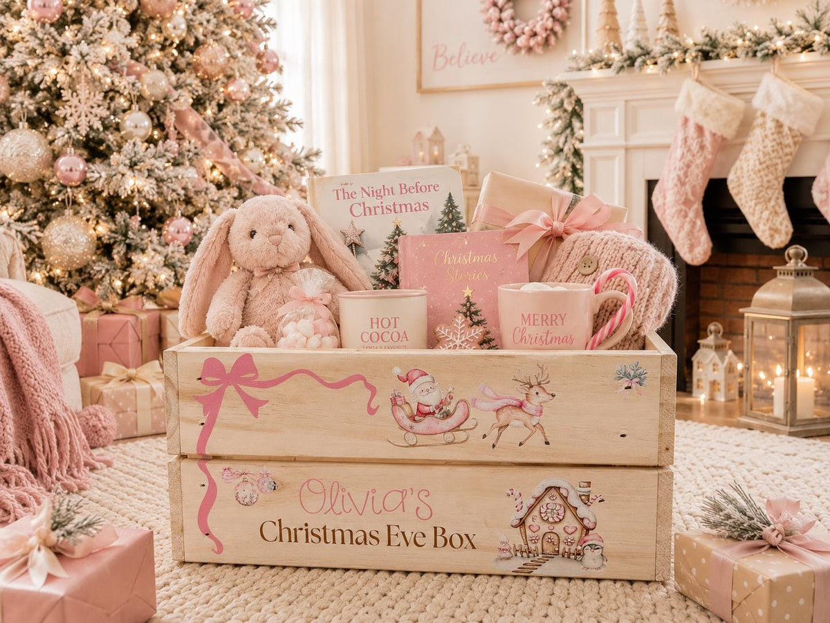 Personalized pink Christmas Eve box for girls filled with holiday gifts